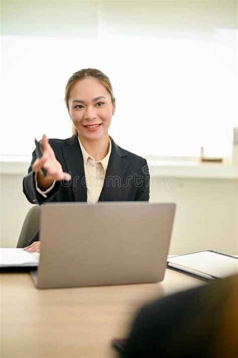 professional asian female hr recruiter or interviewer interviewing a candidate stock image