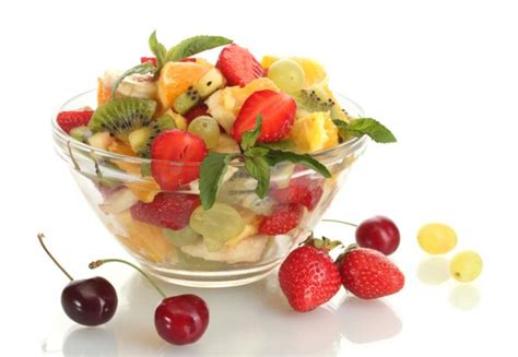 Glass Bowl With Fresh Fruits Salad And Berries Isolated On White Stock