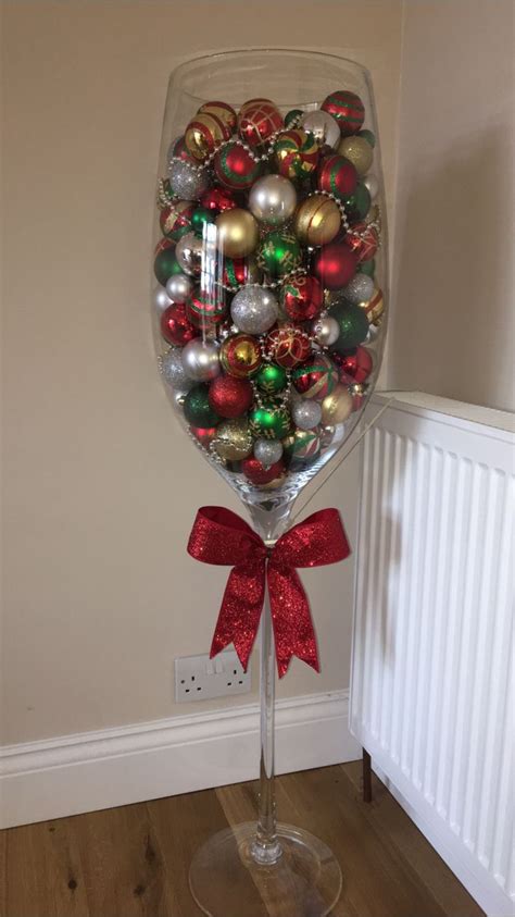 Giant wine glass filled with baubles ðŸŽ„ | Wine glass gifts ideas, Giant