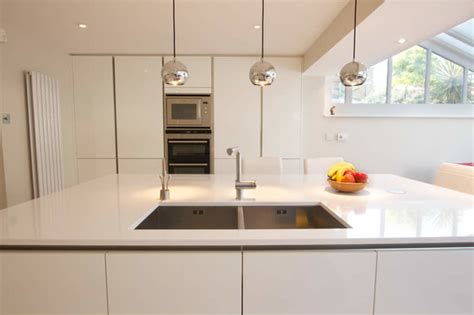 The unique look and personality of this handleless kitchen is royal glossy dark blue cabinets with open shelves in warm wood tones adds comfort and sophisticated feel to any kitchen design. White gloss handleless kitchen - Modern - Kitchen - London ...