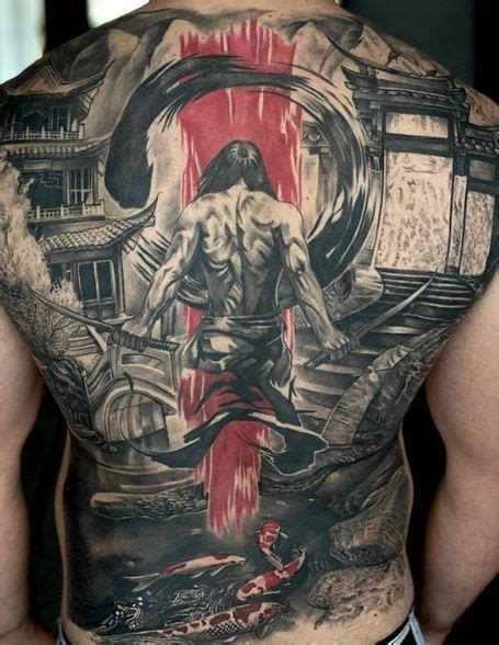 The Back Of A Man S Body With An Image Of A Demon On It