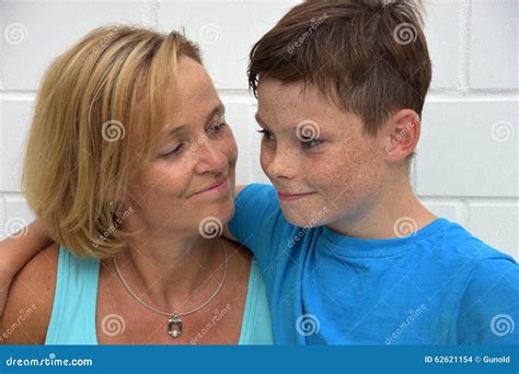Mother Hugging Teenage Son