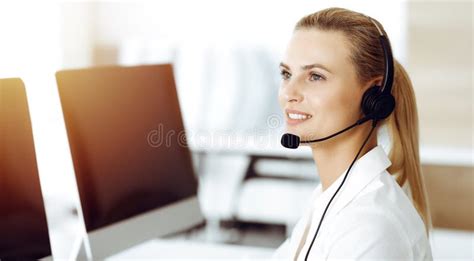 Blond Female Customer Service Representative Is Consulting Clients