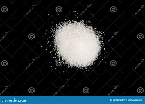 Heap Of White Sugar Isolated On A Black Background A Pile Of Powdered