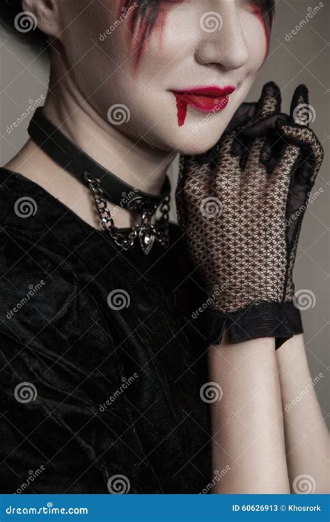 Young Beautiful Gothic Woman With White Skin And Red Lips Halloween