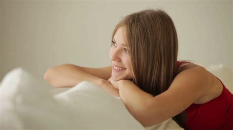 Relaxed Person Smiling On Couch Stock Footage SBV Storyblocks
