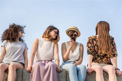 Four Friends Sitting Together Outdoors By Jovo Jovanovic Photoshoot Outdoor Sit