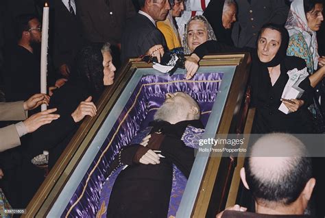 View Of Mourners Surrounding The Body Of Padre Pio In A Coffin Inside