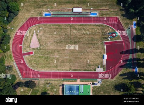 An Aerial View Of An Outdoor Athletics Stadium With Red Oval Running