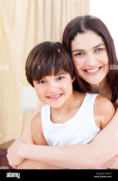 Smiling Mother Hugging Her Son Stock Photo Alamy