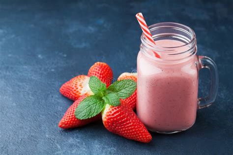 Strawberry Smoothie Or Milkshake In Mason Jar On Dark Blue Table Healthy Food For Breakfast And