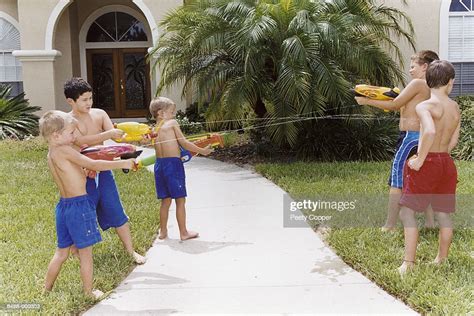 Boys Having Water Gun Fight High Res Stock Photo Getty Images