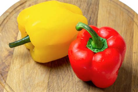 Yellow And Red Fresh Bell Peppers On A Wooden Kitchen Boar Flickr