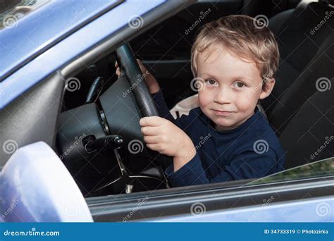 Boy Driving A Car Royalty Free Stock Photo 34733319