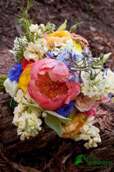 Peony blossoms come in shades of white, cream, pink, rose and deep red; Bride's bouquet with coral charm peonies, garden roses ...