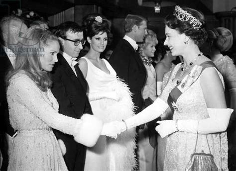 Queen Elizabeth Ii Shakes Hands Wursula Andress After Woody Allen