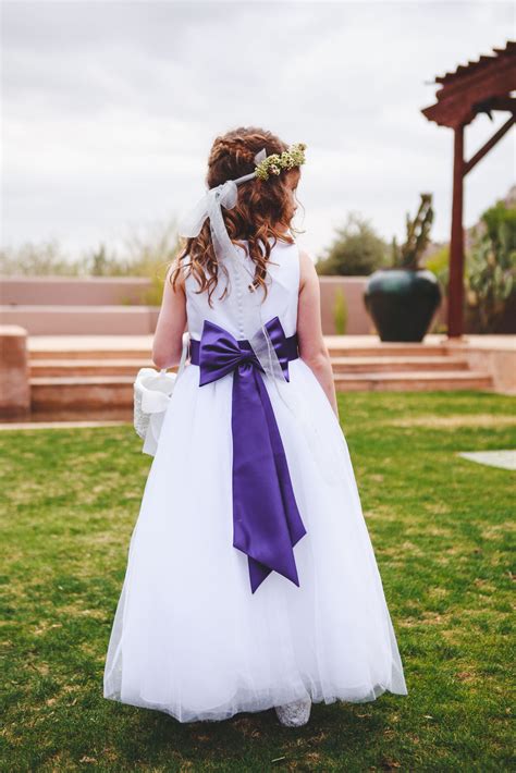 white flower girl dress with purple satin sash