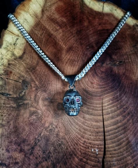Hand Carved Sterling Silver Skull With Rubys For Eyes Curiosities