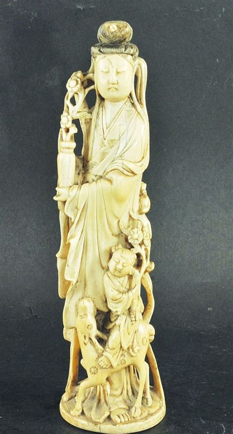 A 19th Century Chinese Carved Ivory Group Of A