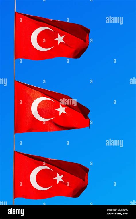 Three Turkish Flags On A Blue Sky Background Stock Photo Alamy