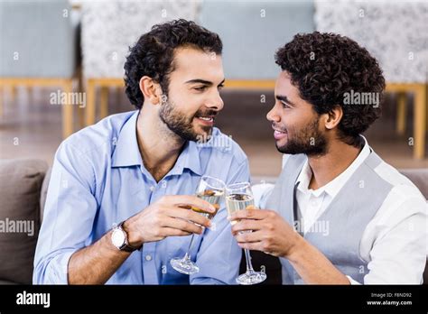 Happy Gay Couple Drinking Champagne Stock Photo Alamy