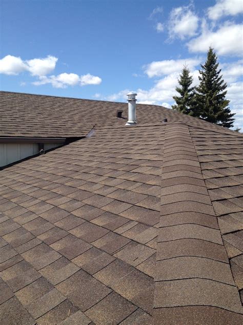 Photography courtesy of amy wax. Recently completed asphalt shingle roof in Cochrane. Product installed was GAF Timberline HD ...