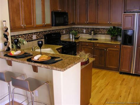 Get inspired by our favorite dark, medium, and light wood a simple subway tile backsplash allows the distinctive dark wood cabinetry in this small kitchen to shine. Pictures of Kitchens - Traditional - Dark Wood Kitchens ...