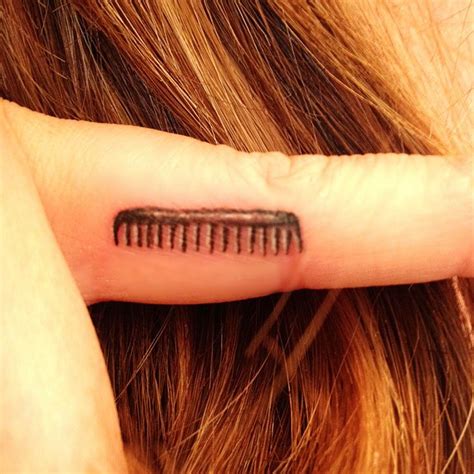 Terrific Traditional Comb Tattoo Design By Frank Ready
