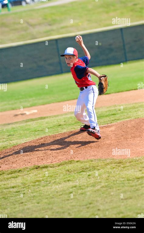 Little League Baseball Pitcher Throwing The Ball Stock Photo Alamy