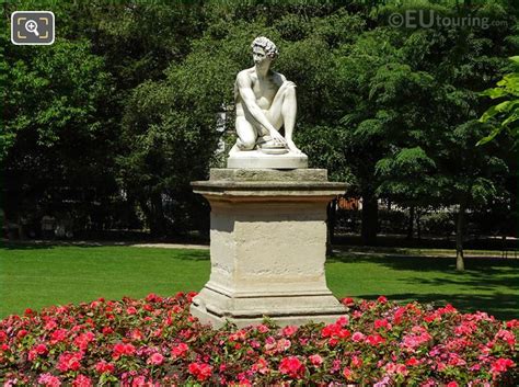 Red Flowers Around Archidamas Statue In Luxembourg Gardens Page