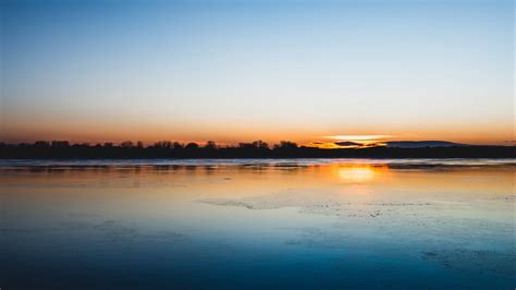 Download Wallpaper 1600x900 Lake Sunset Horizon Distant Twilight
