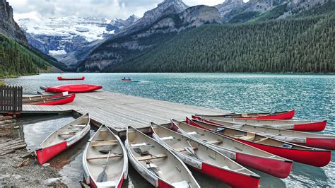 Alberta Canada Canoe Lake With Boats And Louise Marina Mountain Hd