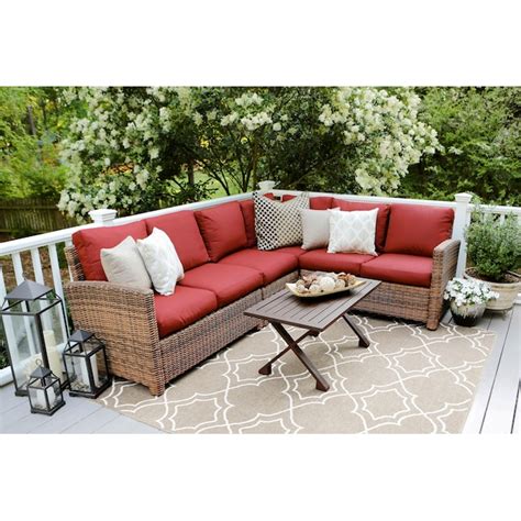 leisure made dalton 5 piece wicker patio conversation set with red cushions in the patio
