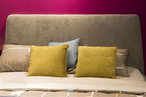 Stylish Pink Bedroom Interior Design With Decorate Pillows On Grey