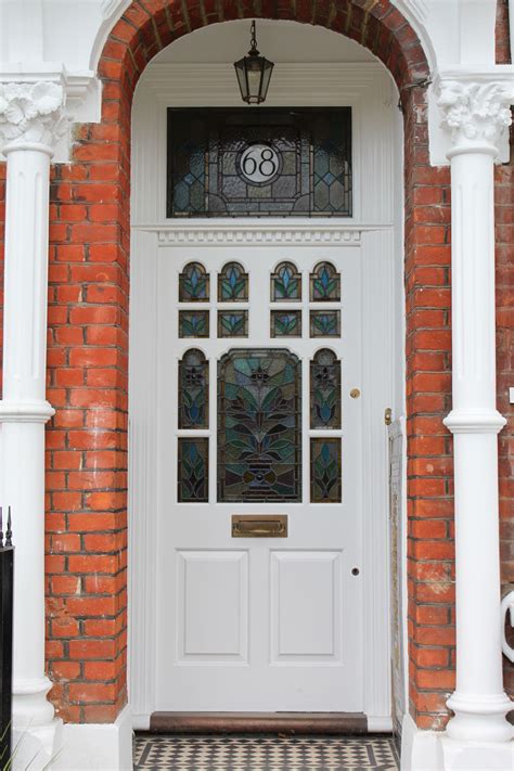 A Late Victorian Front Door With Floral Leaded Light Doors