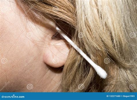 A Woman Cleans Her Ears With A Cotton Swab Stock Photo Image Of