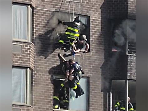 Video Watch Fdny Rescue Woman Hanging Outside 20th Floor In Manhattan