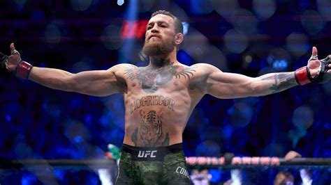 Conor Mcgregor Is Standing In Blur Blue Lights Background Hd Conor