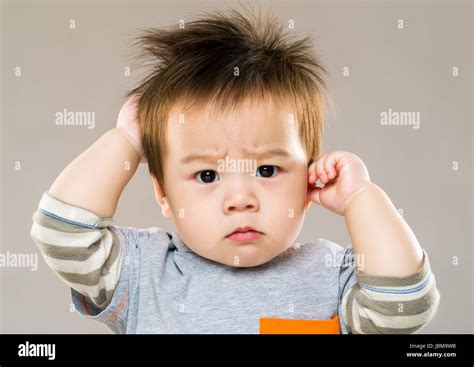 Baby Boy Feeling Confused Stock Photo Alamy