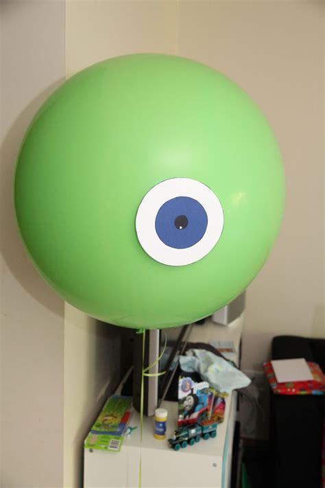 A Green Balloon With An Eye On It