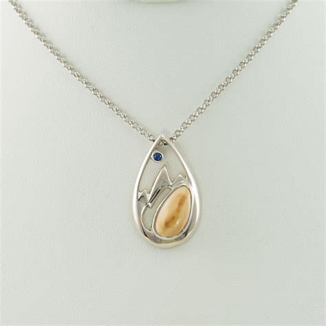 Silver Teton Pendant With Elk Ivory And A Montana Blue Sapphire
