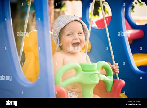 Happy Baby Girl Having Fun On A Swing Stock Photo Alamy