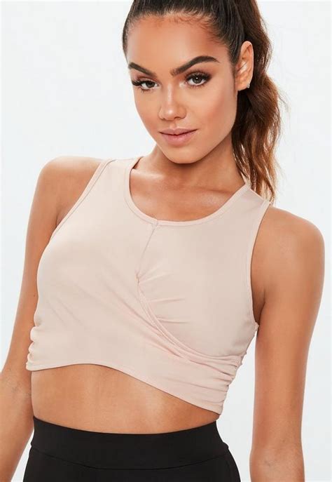 Shopping for a sports bra is a challenge, but we've made it easy. Active Pink Wrap Front Sports Bra | Missguided Ireland