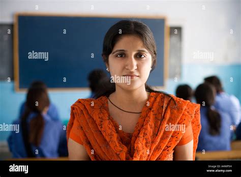 Teacher Smiling In Classroom Stock Photo Alamy