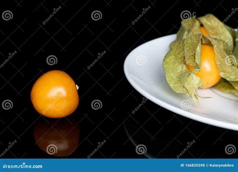 Fresh Orange Physalis Isolated On Black Glass Stock Photo Image Of