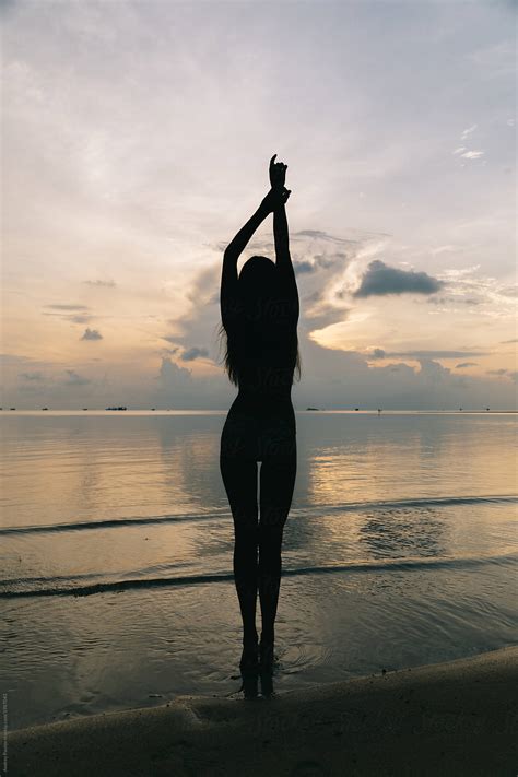 Silhouette Of A Beautiful Woman On The Beach By Andrey Pavlov