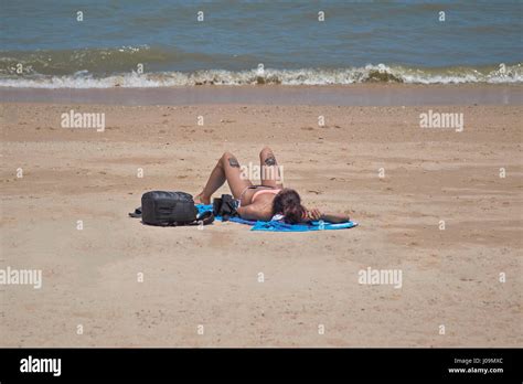 Women Sunbathing On Beach Hi Res Stock Photography And Images Alamy