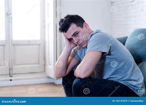 Young Attractive Man Suffering From Depression In Emotional Pain Lying
