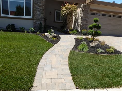 One easy front paver walkway idea that still packs a lot of appeal is incorporating flanking bands that line the walkway on either side. Paver Walkway | Front Yard ideas | Pinterest