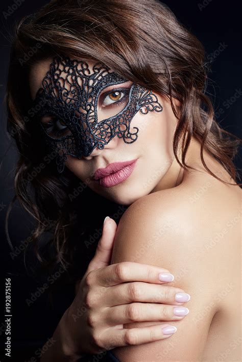 Mysterious Girl In A Black Mask Masquerade Sexy Nude Brunette Woman With Curly Hair On A Black